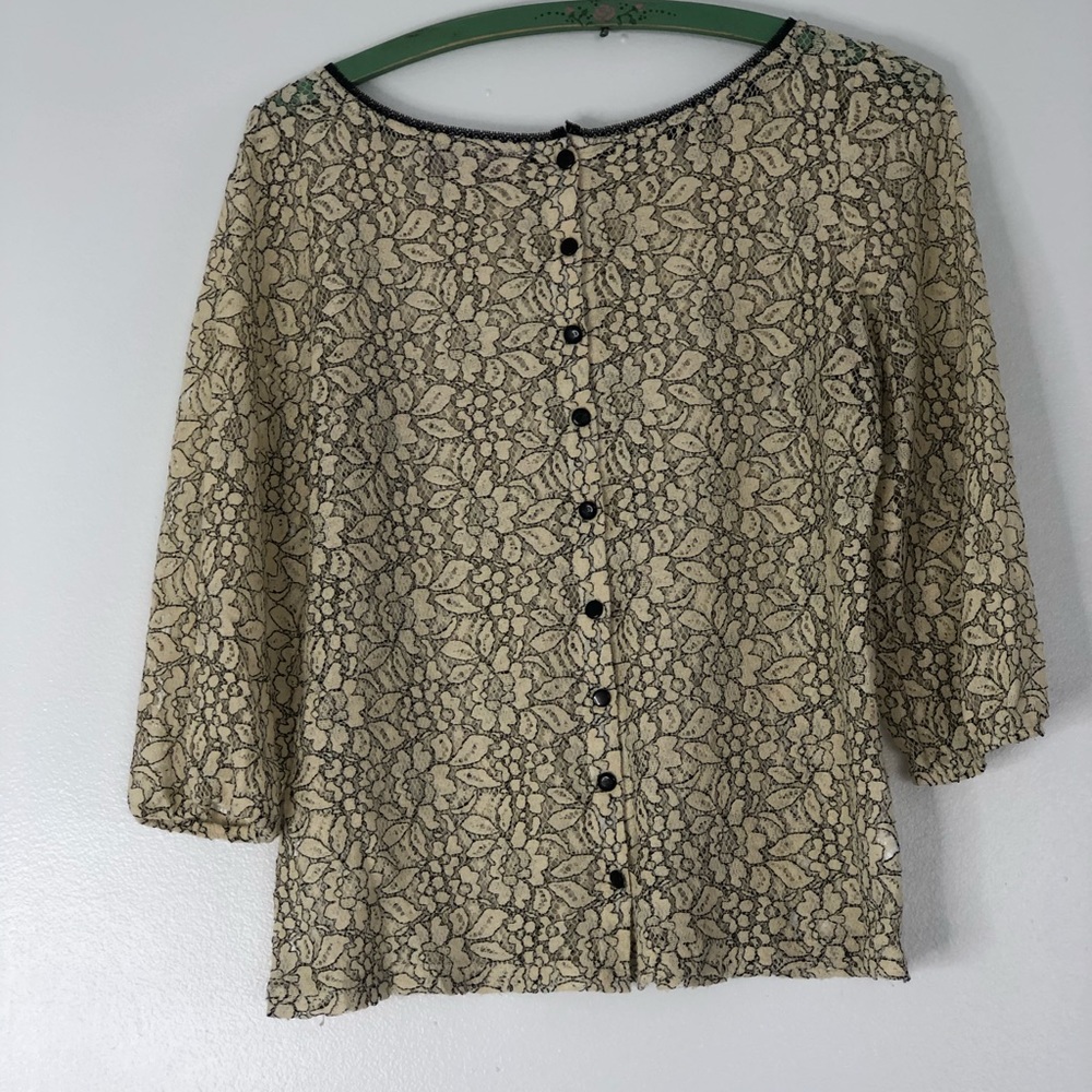 Ann Taylor.  beautiful black buttons in the back.